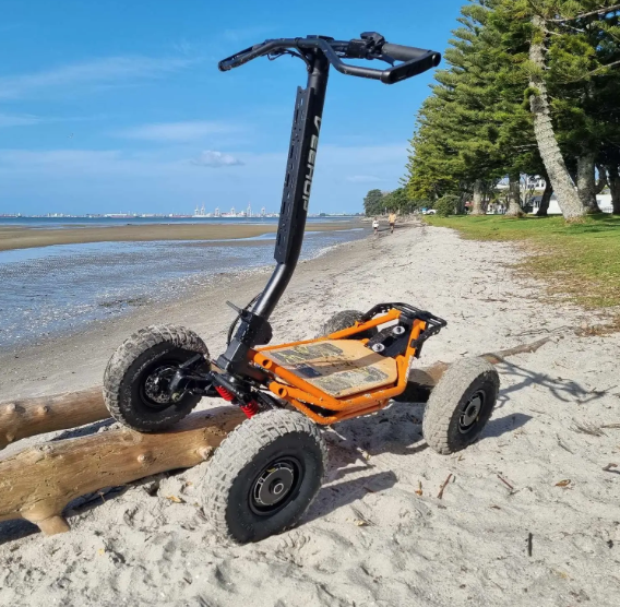 AMPED OUT MACHINES electric mini ATV on the beach