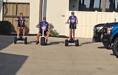 Amped Out Machines electric rides used around a race track and pit area